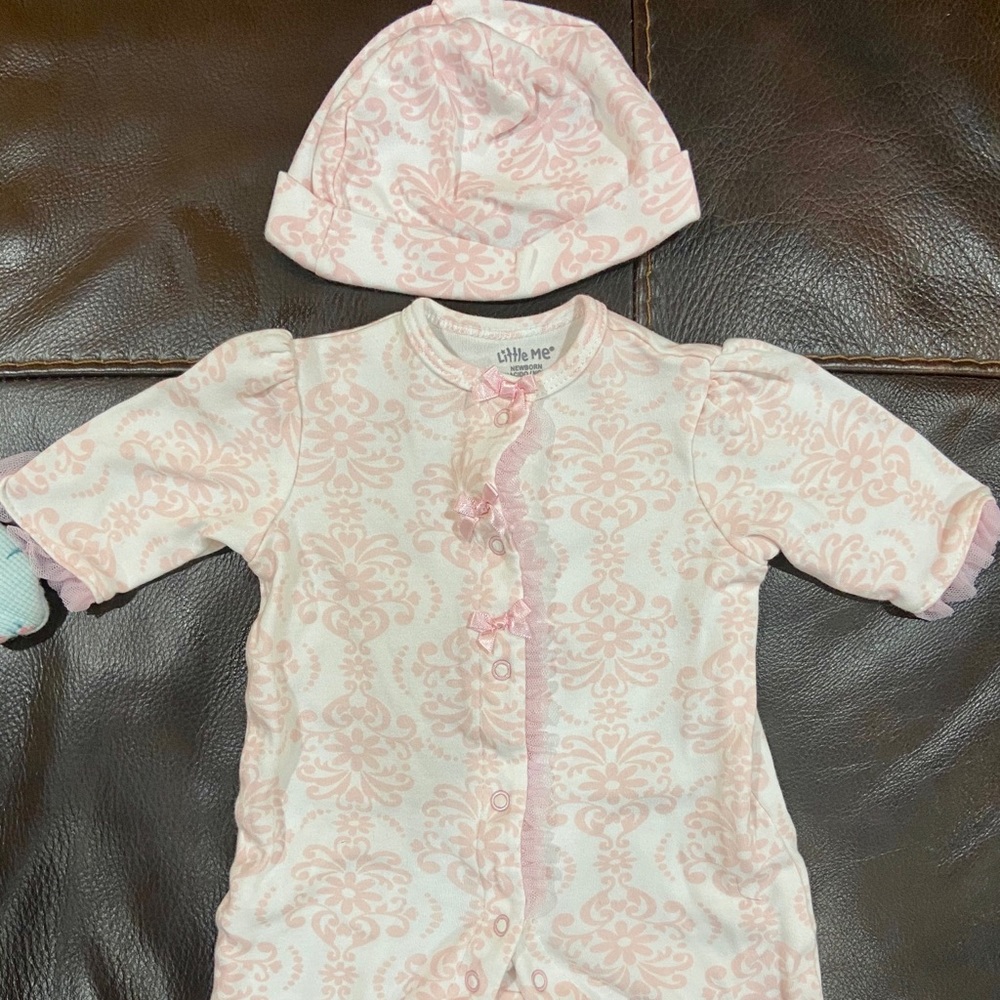Newborn onesie with matching hat. Wore once!